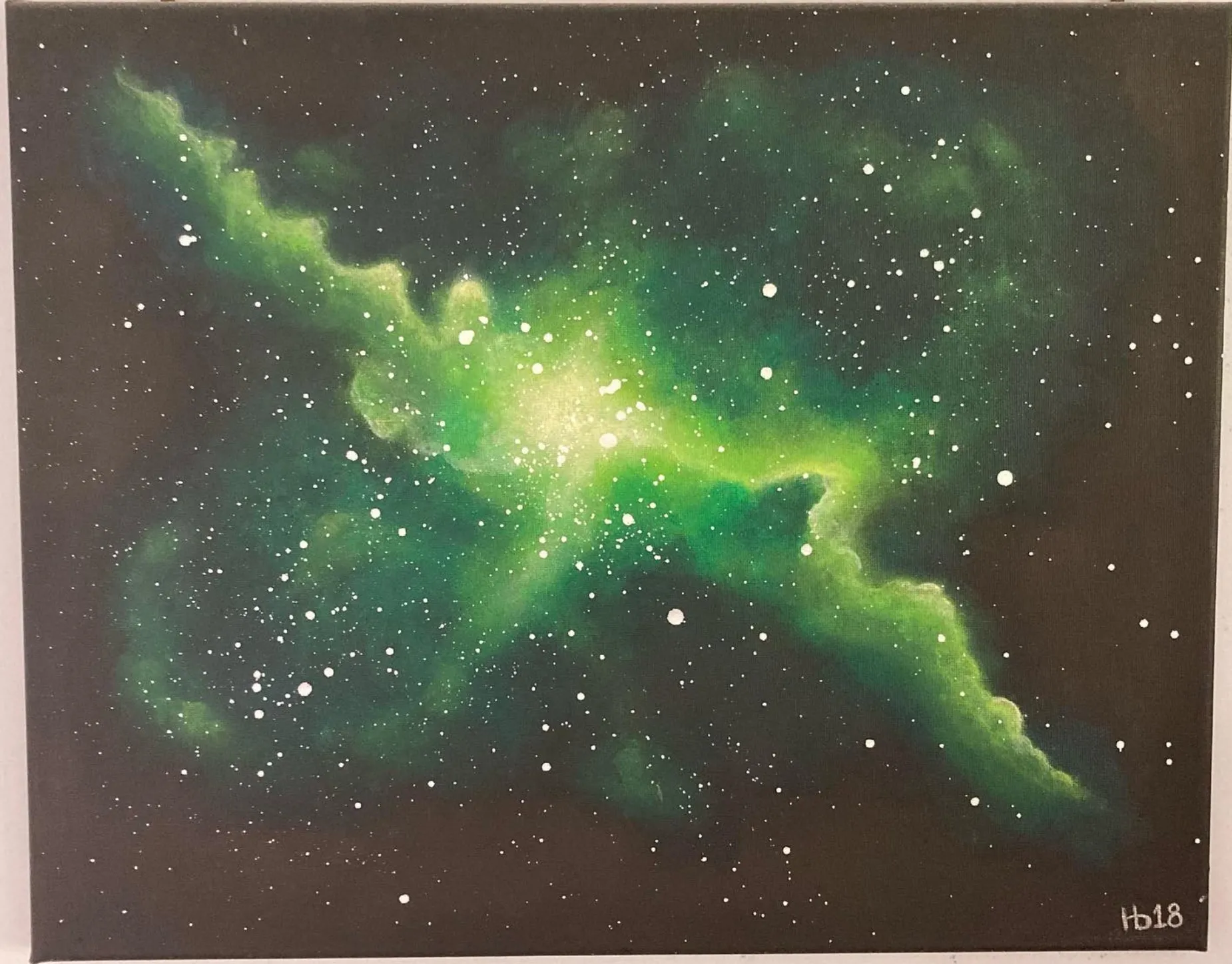 Smaragdine. A green nebula scattered across a field of stars.
